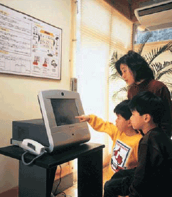Photo image: Using information terminal