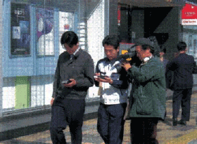 Photo image:Monitor users with PDA terminals